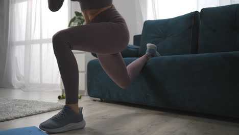 closeup-view-of-slender-legs-of-young-woman-training-at-home-athletic-lady-is-doing-exercises-for-legs-muscles-female-sporty-person